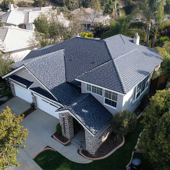 Aerial view of a residential home with a newly installed shingle roof, showing clean lines, curb appeal, and dependable Roof Repair Fellsmere, FL services.
